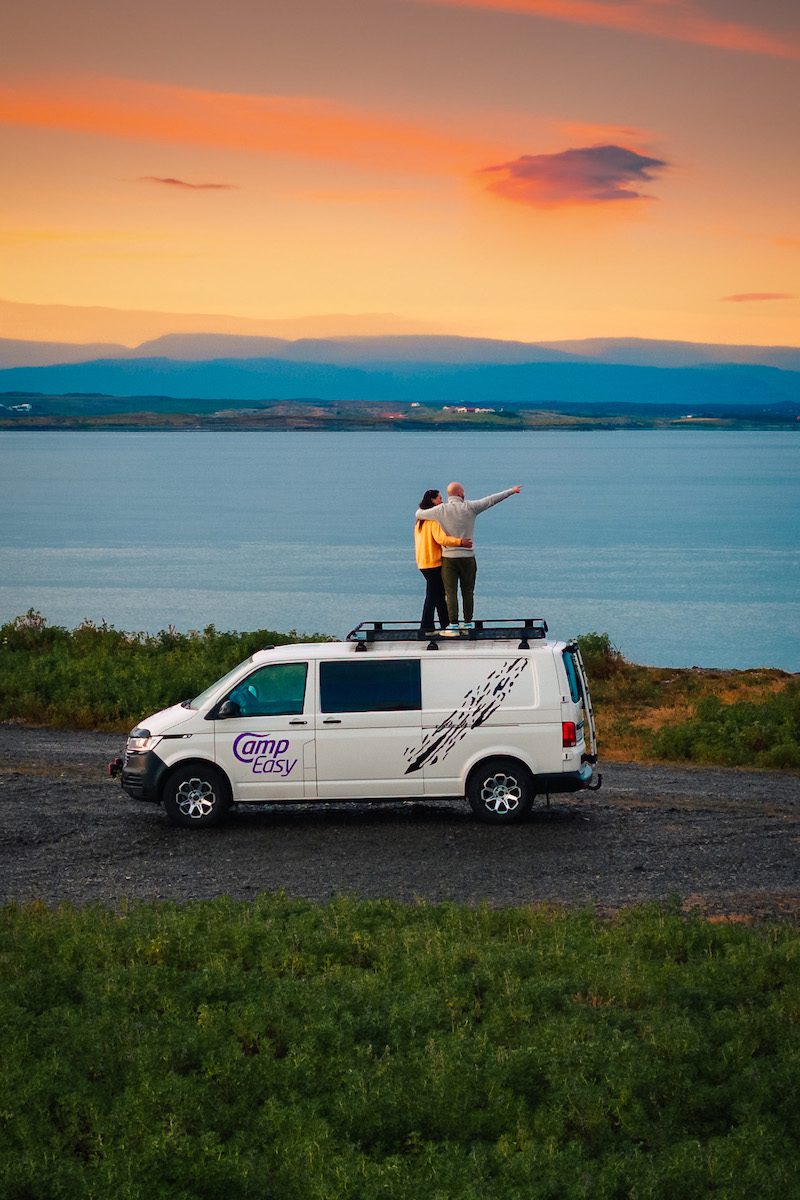 Woman next to the campervan