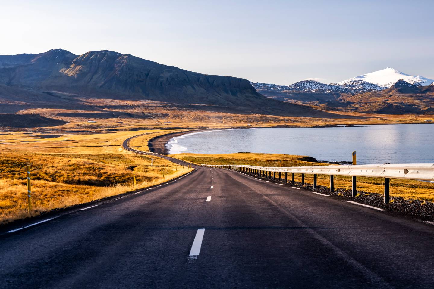 Scenic view of a winding road, surrounded by lush landscapes during a trip in Iceland.